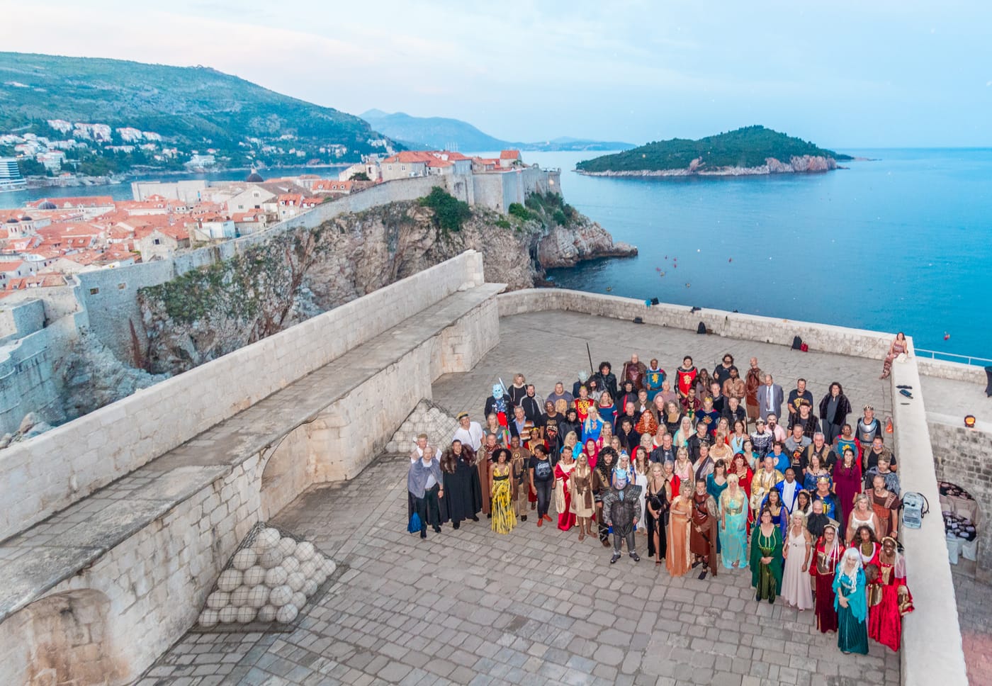 A delegate group photographed on the Dubrovnik city walls at a themed dinner organised by Adria Congress