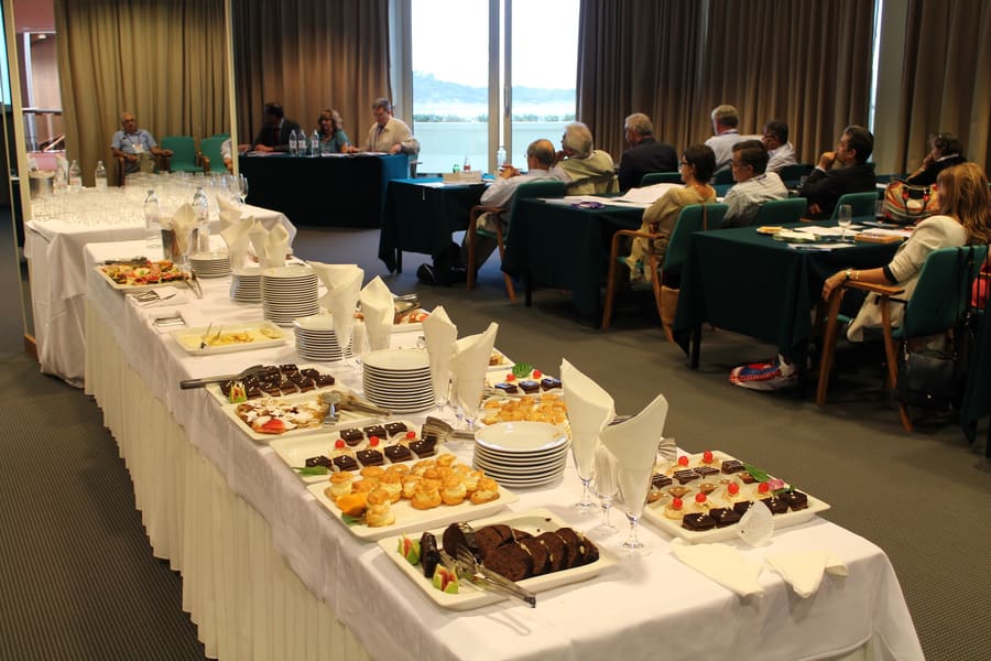 Catering laid out beside a meeting room overlooking the sea