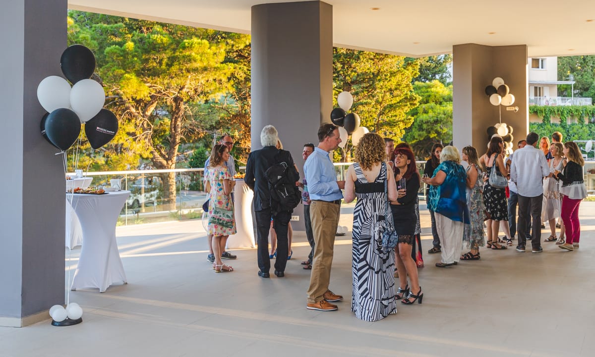 Guests at an outdoor welcome reception organised by Adria Congress